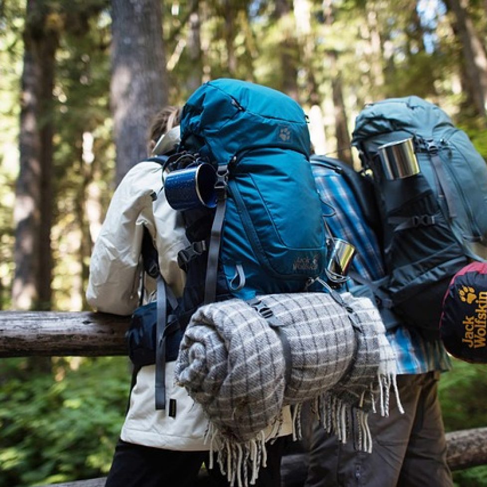 men in backpack
